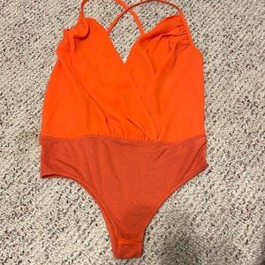 Revolve super down adjustable strap Small orange body suit